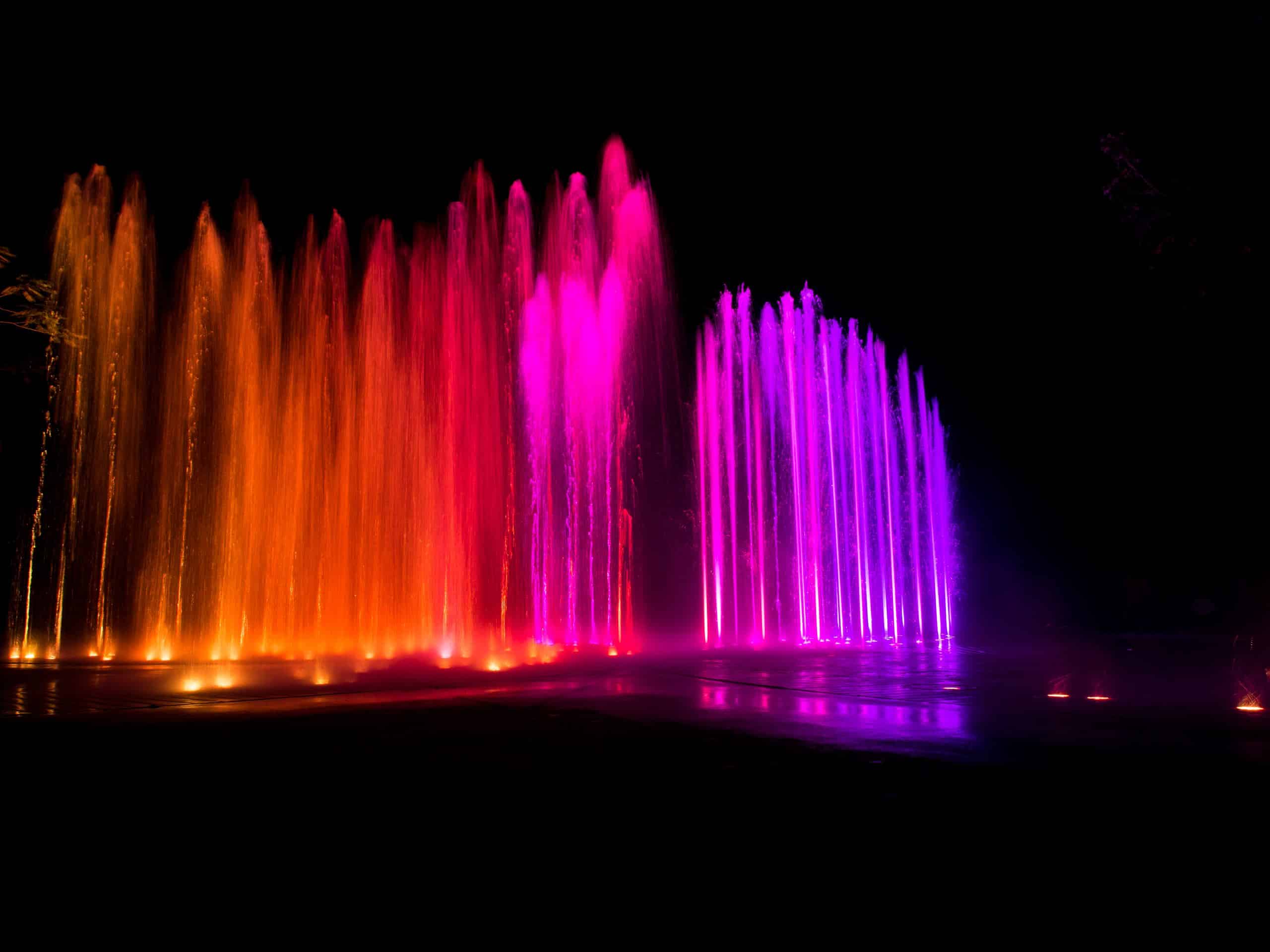 colored decorative dancing water jet led light fountain show at night